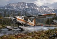 De Havilland DHC-3 Otter bush plane on floats in remote northern terrain